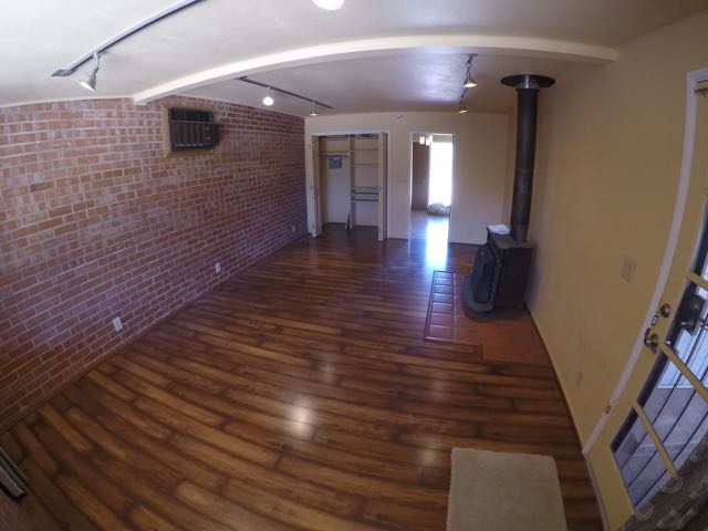 Extra large office / den with new wood laminate floors and air conditioning