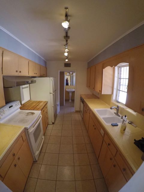 Galley kitchen with dishwasher, 23 cu ft fridge, glass-top stove, new sink and faucet