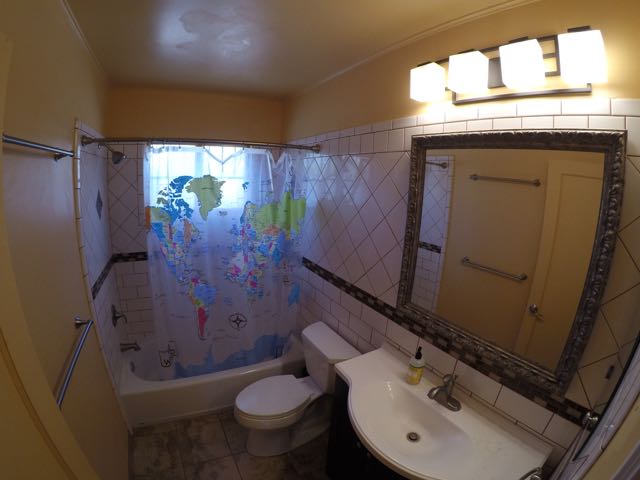 All new full bath, tile with glass tile inset motif