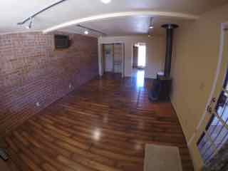 Extra large office / den with new wood laminate floors, wood-burning stove and air conditioning