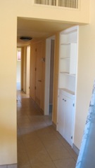Hallway with built-in bookshelf